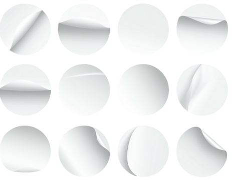 Twelve round, white stickers, each with a creased, curled edge, arranged in a 3x4 grid on a black background