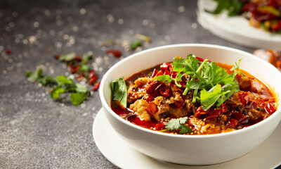 skewered vegetables and meat cooked in a hot and spicy soup