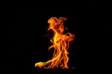 Close up burning flames on black background for graphic design or wallpaper.