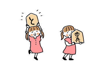 大きな将棋の駒を持つ女の子