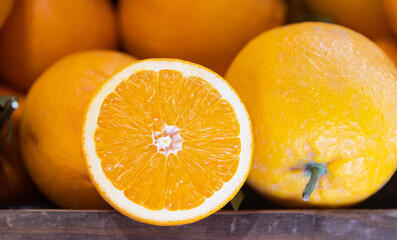 Oranges on the grocery store counter.