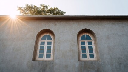 Sunlight kisses twin arched windows, evoking whispers of Vesak serenity and rustic Mediterranean charm amid tranquil dawn