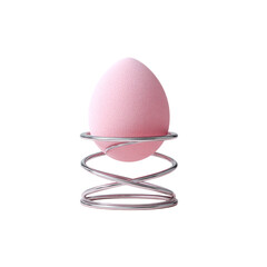 Delicate pink beauty blender elegantly displayed on a modern metallic spring stand, perfect for makeup tutorials, product showcases, and cosmetic advertising