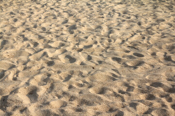 Beach sand texture background at the sea.