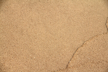 Beach sand texture background at the sea.