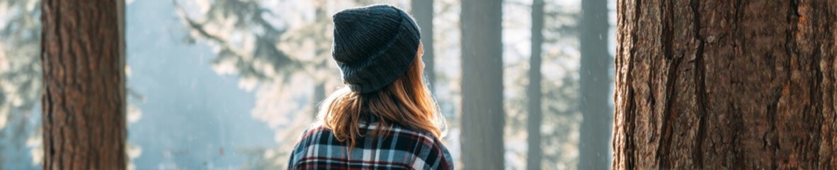 Auburn-haired woman, nestled in flannel, gazes at misty woodland, evoking Forest Bathing Day, Nordic hygge whispers