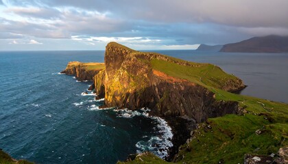 Dramatic coastal cliffs and ocean waves at sunset