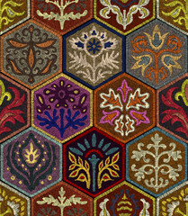 Colorful seamless pattern imitating embroidery. Hexagonal layout with floral folk ornaments. Decorative stitched texture. Vector illustration.