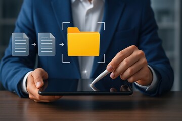 Businessman using stylus and tablet to transfer digital documents into secure yellow folder interface