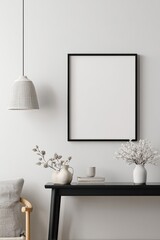 Minimalist living room corner with framed art and decorative accents.