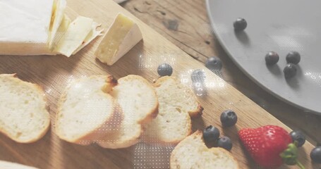 Close-up shot causing binary overlays drifting as camera tilting showing cheese bread berries - Powered by Adobe