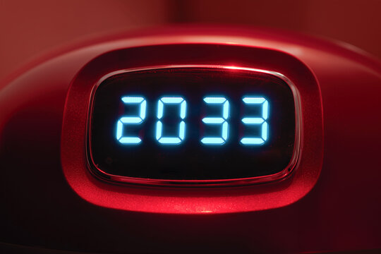 2033 on the monitor of futuristic technology as a symbol of the future and the transience of time and the development of technology for humanity - Powered by Adobe