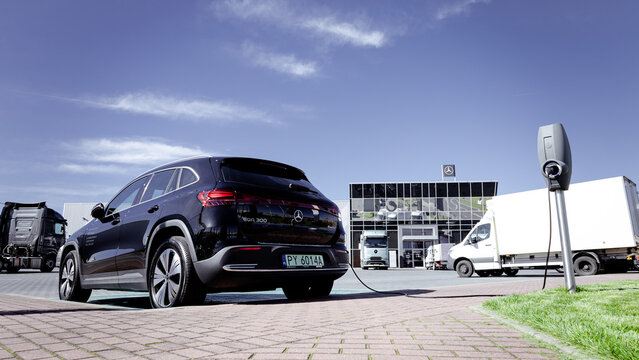 Poznan, Poland - September 24, 2025. Mercedes EQA 300 electric car charging in a parking lot at a Mercedes dealership.