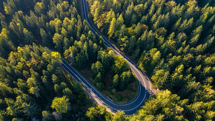 Aerial drone view of winding mountain road near Szklarska Poręba, Czech Republic. 
