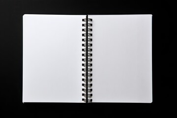 Open spiral-bound notebook, blank pages, black background (1)