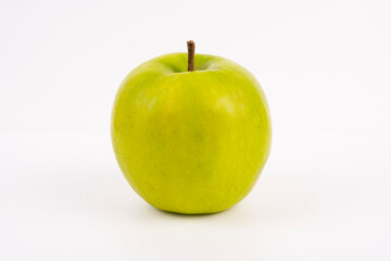 A fresh, bright green apple sits alone on a clean white background.