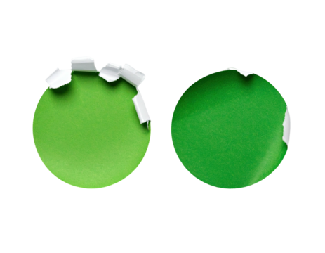 Two identical circular, bright green stickers with white torn edges against a black background