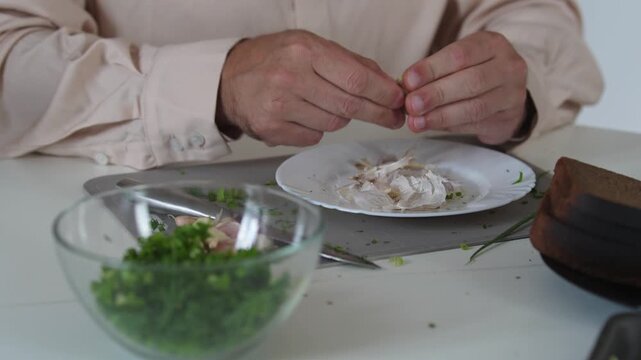 A chef professionally prepares a fresh vegetable salad, chopping potatoes, eggs, and greens. Dynamic cooking process showcasing culinary skills and healthy food preparation