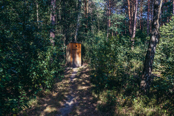 Small wooden prive hidden among tress in forest in Podlasie region of Poland © Fotokon
