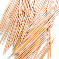 Wooden toothpicks as background closeup