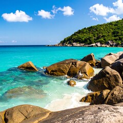 Tropical beach scene with turquoise water and rocks