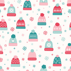 Colourful seamless pattern with winter hats in cartoon style. Vector illustration