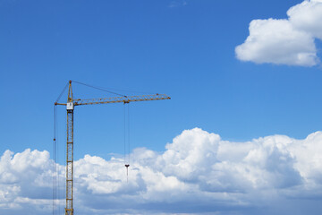Obraz premium Construction Crane Against a Blue Sky