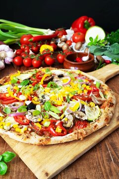 Healthy vegetarian pizza with whole wheat crust and fresh vegetables