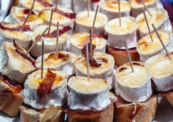 Plate with traditional Spanish snacks called pinchos in San Sebastian city also called Donostia in Gipuzkoa region of Spain