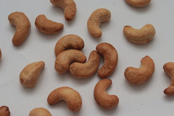 Cashews laying on white background 