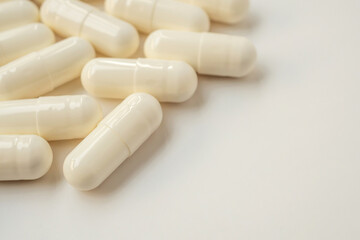 White medicine pills capsule on white background