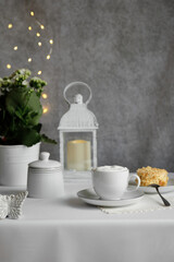 Coffee break with dessert and decorative lantern.