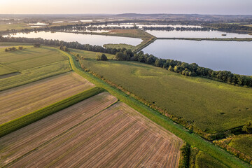 Aerial drone view of farmland and fish ponds in summer, Poland