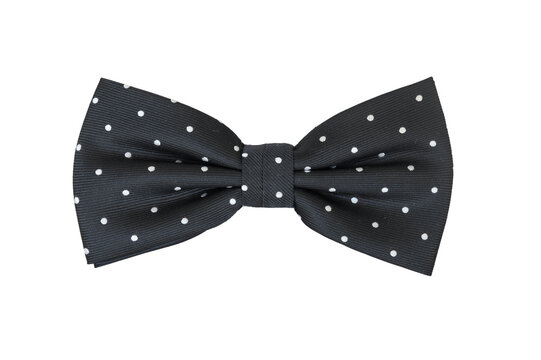 Classic black polka dot bow tie isolated on a white background.
