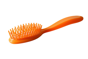 Orange hairbrush product on black background beauty grooming personal care styling hygiene hair