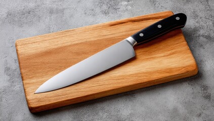 Chef's knife on a wooden cutting board