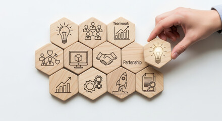 Fototapeta premium In a professional business setting, a human hand positions a wooden hexagon with an illuminated light bulb idea symbol, showcasing innovation with natural wood tones.