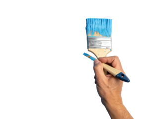 Hand holding a paintbrush with blue paint