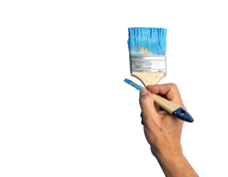 Hand holding a paintbrush with blue paint