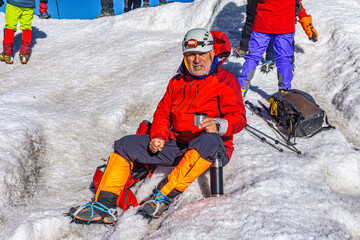 The mountaineer is at the summit of Mount Ararat, with an elevation of 5,137 m (16,854 ft), also...