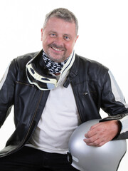 smiling handsome middle aged man sit with motorcycle helmet happy wearing leather black motorbike jacket on white background