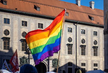LGBTQ flag waving at political protest in Munich Bavaria Germany