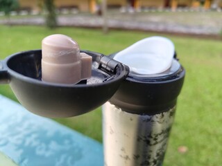 background of an open water bottle