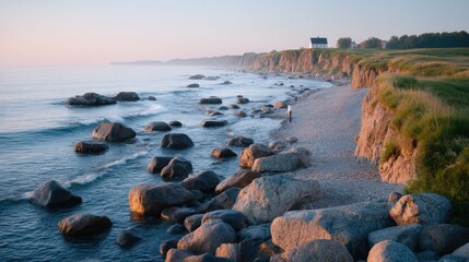 Lone Fisherman on Rocky Shore at Dusk in Cinematic Seascape with Warm Tones and Blue Sea near Cliff in Idyllic Coastal Setting