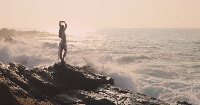 Epic Cinematic Shot Of Woman On Cliffside At Sunset In Sri Lanka