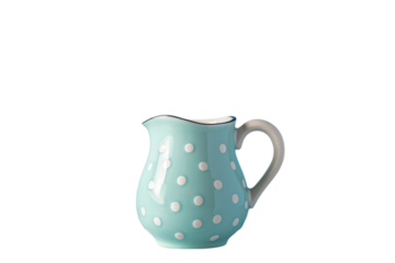 A charming turquoise polka dot pitcher set against a stark black background. Ceramic jug. A touch of vintage charm for your kitchen.