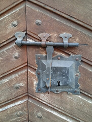 old Swiss wooden door with metal lock