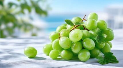 Lush Green Grapes Cluster with Water Droplets on White Surface in Sunlight Displaying Freshness and Natural Beauty with a Bright Outdoor Background