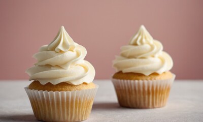 homemade cupcakes with paper toppers and cream frosting