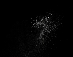Obraz premium Abstract, white particles suspended in mid-air against a black background